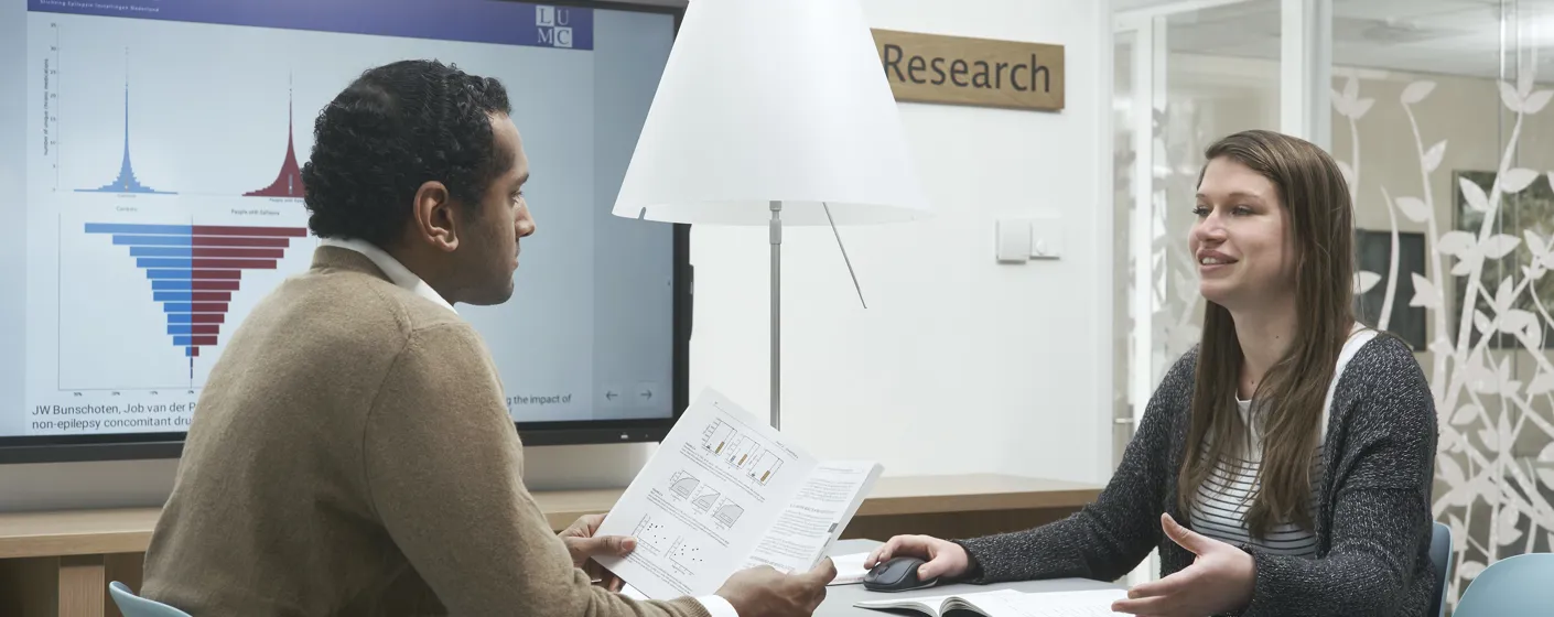 conversation between two people at SEIN Research